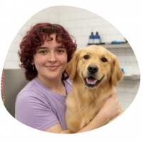 Mobile Dog Groomers A picture of Hanaa with a golden retriever dog